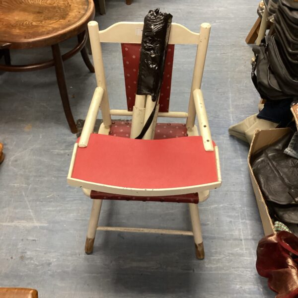 Vintage 1950s baby high chair with red seat.