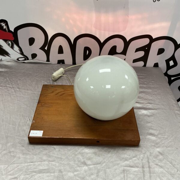 Vintage ball lamp with frosted glass and wooden base.