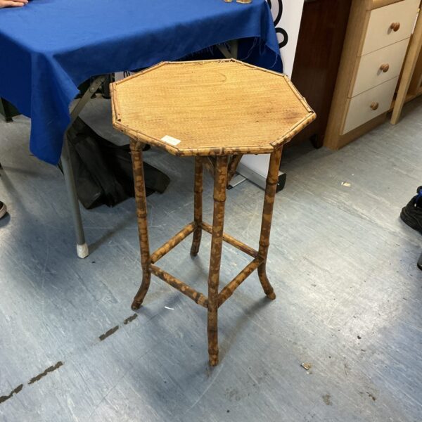 Vintage bamboo centre table with hexagonal top and slender legs.
