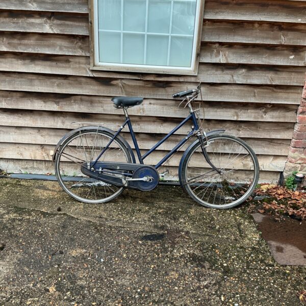 Vintage bicycle, “The Number”, with step-through frame and mudguards.