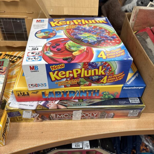Vintage board games lot including Kerplunk and Monopoly.
