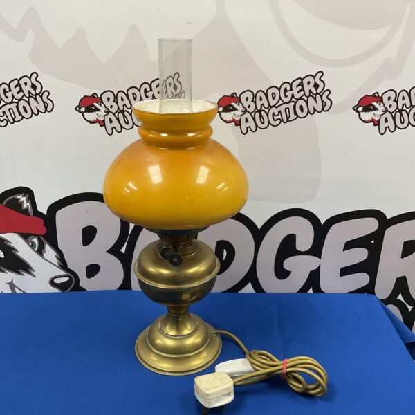 Vintage brass table lamp with amber glass shade.