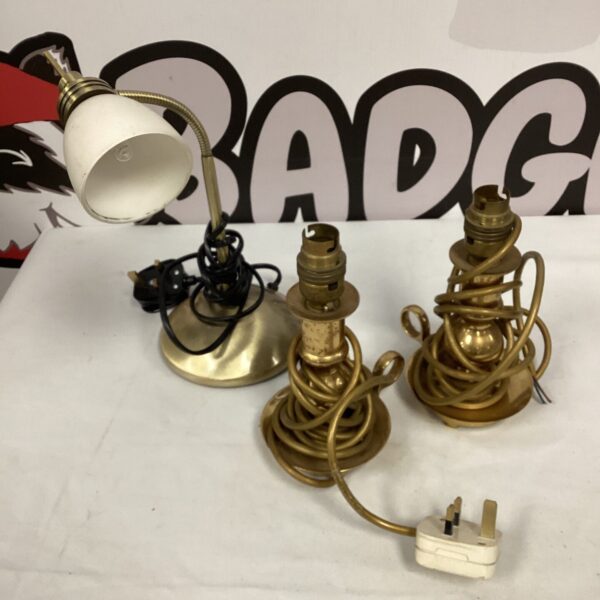 Lot of three vintage brass table lamps with adjustable shades.