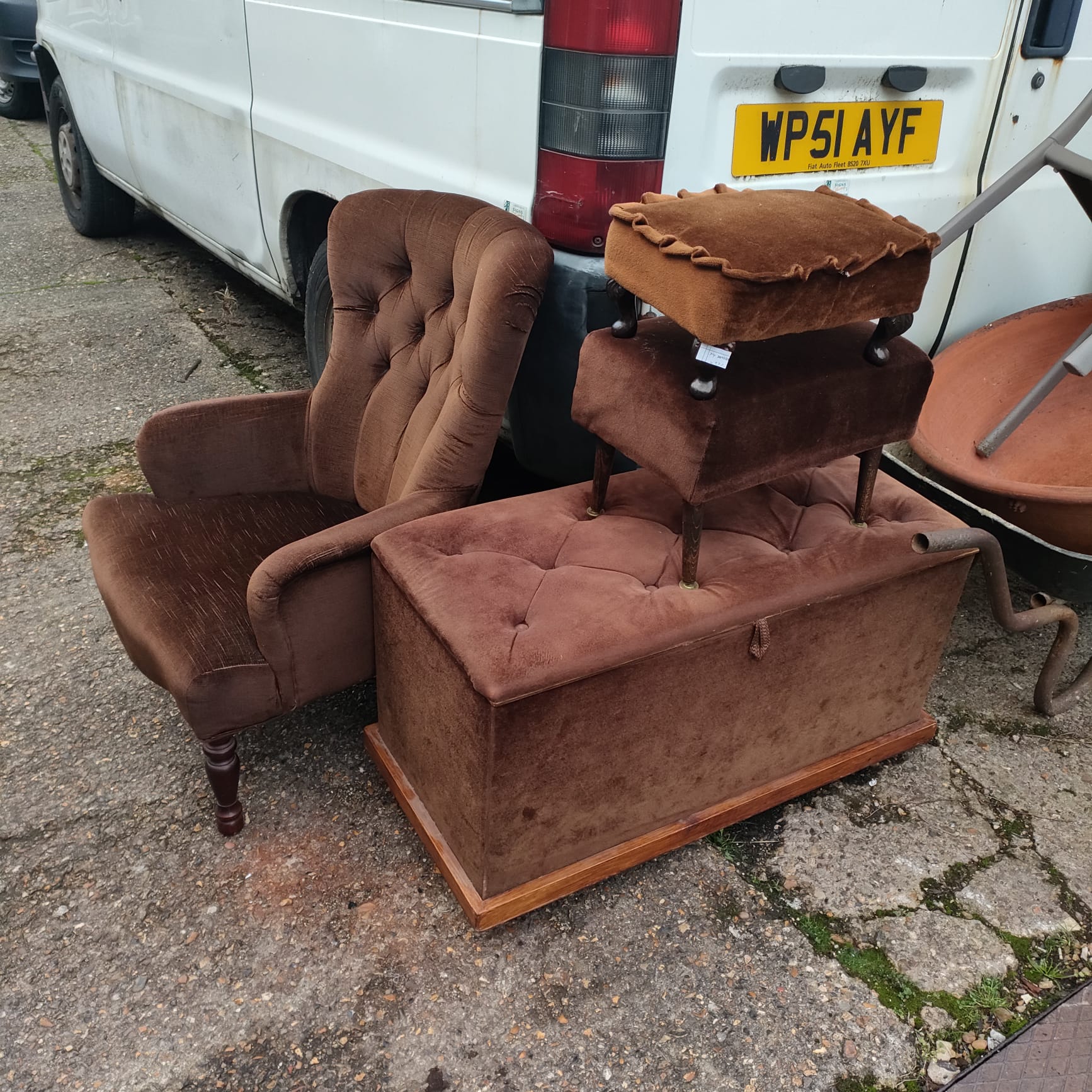 Vintage brown furniture set including a nursing chair and ottoman.