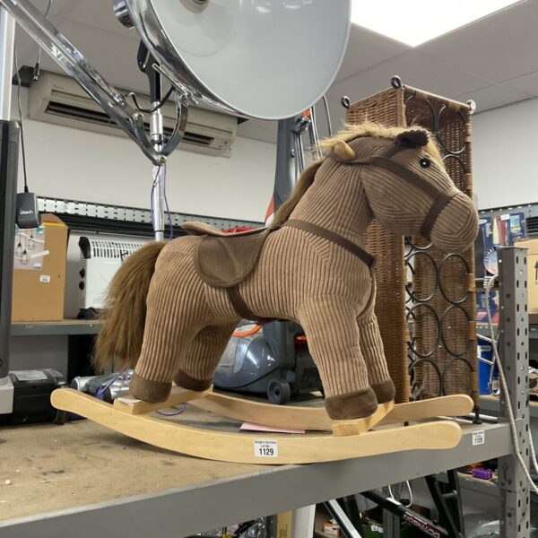 Vintage brown rocking horse for children’s playroom.
