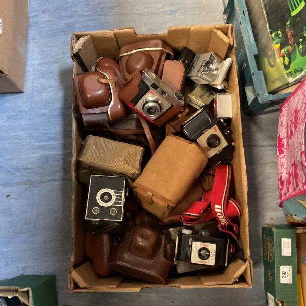 Vintage camera lot featuring Kodak, Coronet, and Canon cameras.