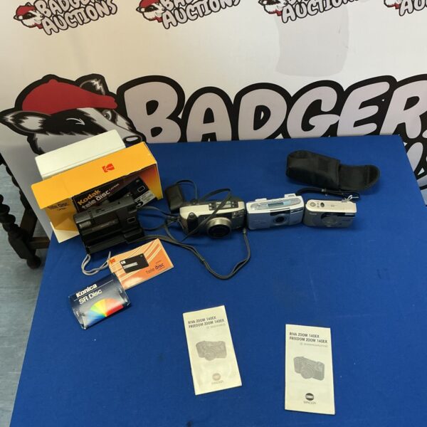 Vintage camera lot including Kodak Tele Disc and Minolta Riva Zoom.