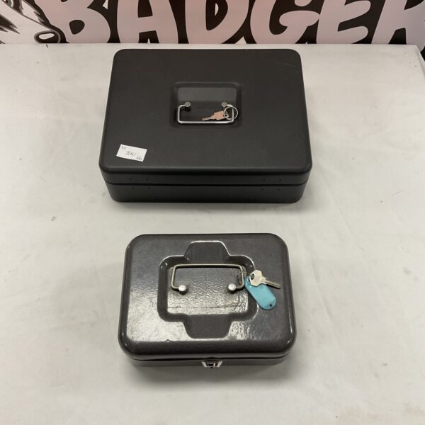 Vintage cash tin with key lock, collectible metal box.