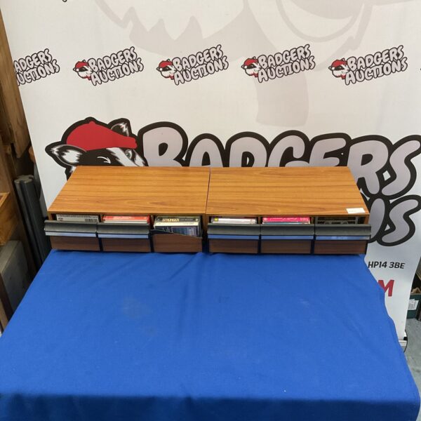 Vintage cassette storage drawers for audio tape collection.