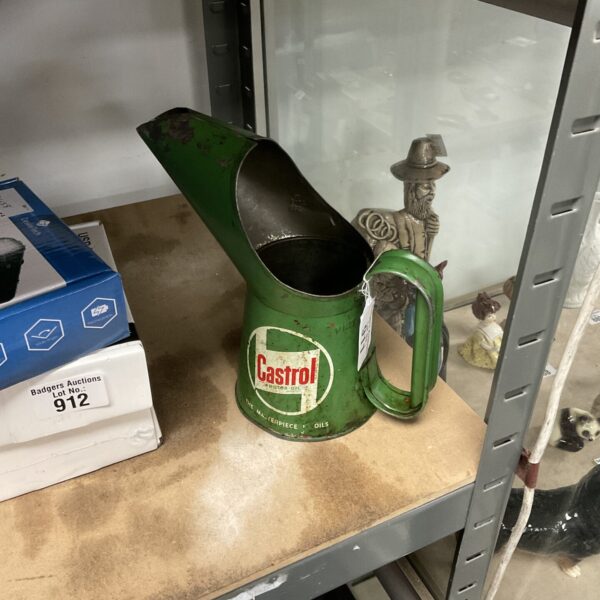 Vintage Castro oil can, collectible automotive memorabilia.