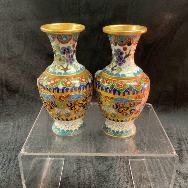 Vibrant vintage ceramic vase with floral design.