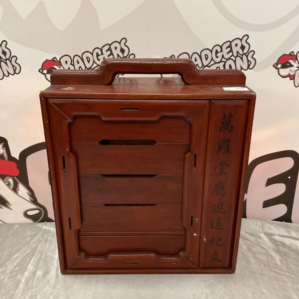 Vintage Chinese medicine cabinet with wooden drawers for storage.