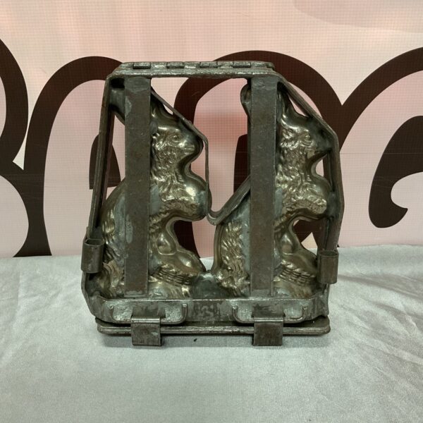 Vintage metal chocolate mould with bunny rabbits.