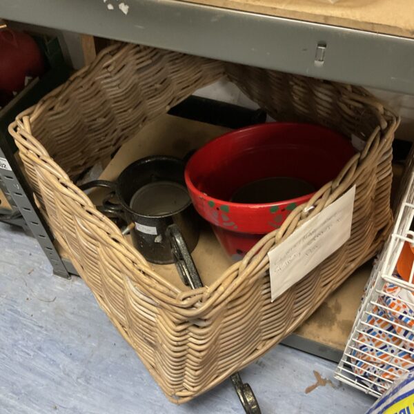 Vintage Christmas tree skirt with wicker stand and pot.
