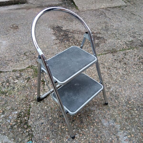Vintage chrome kitchen steps with folding design for kitchen use.
