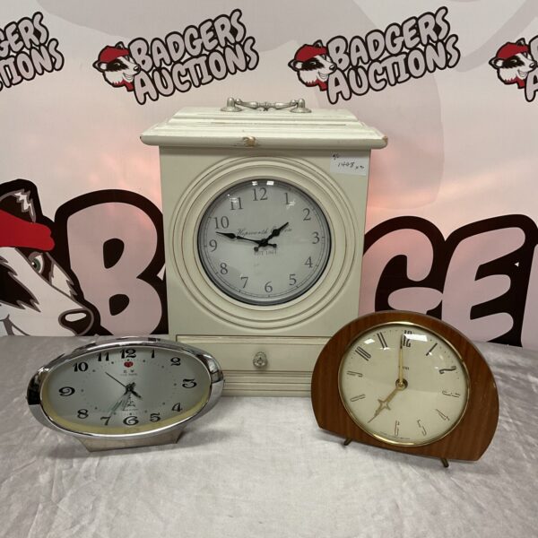 Vintage clock collection featuring Smiths, Five Rams, and Hepworth timepieces.