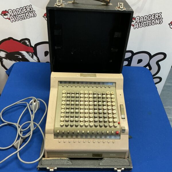 Vintage Comptometer 993s calculator in its original case.