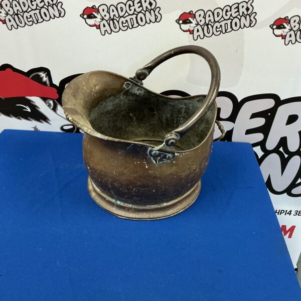 Vintage copper coal bucket with handle, antique fireplace accessory.