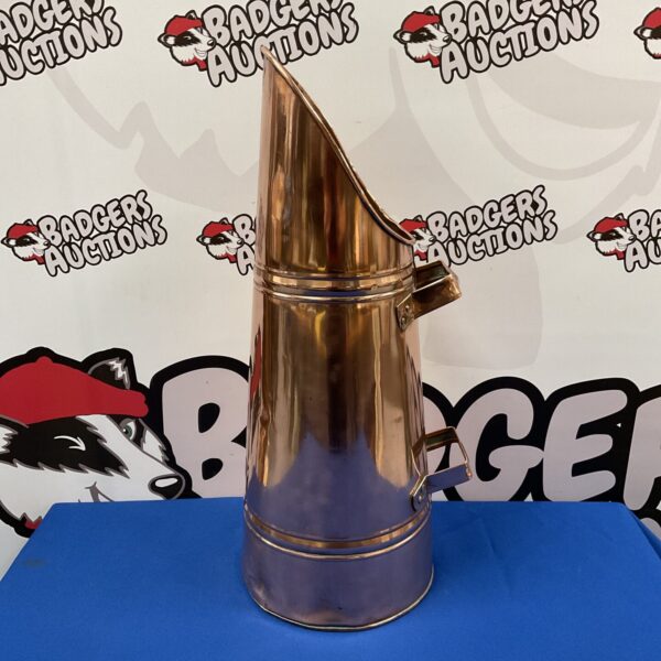 Vintage copper coal scuttle with twin handles for fireplace use.