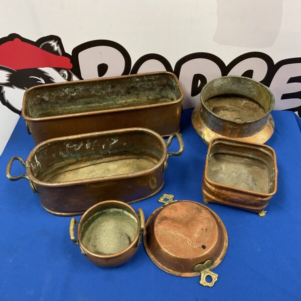 Lot of vintage copper trough planters and pots for garden decor.