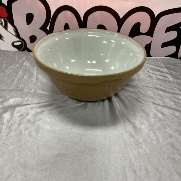 Large vintage cream enamel mixing bowl for kitchen use.