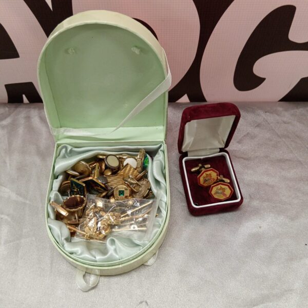Vintage cufflink collection with speckled hen design, men's accessories.