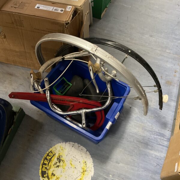 Vintage Peugeot bicycle parts including mudguards in a box.