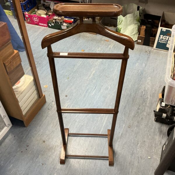 Vintage dark wood clothes stand for coats and hats.