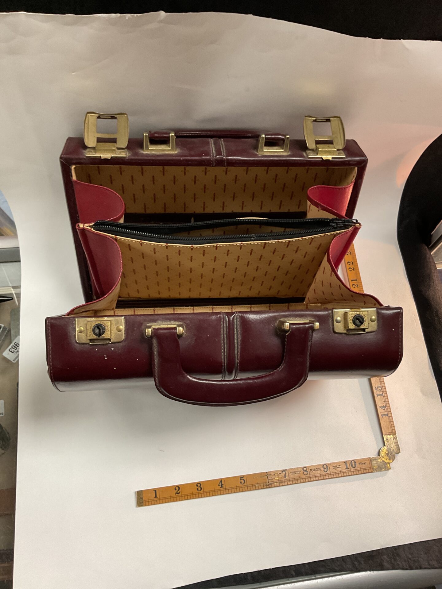Vintage doctors bag with a ruler for scale.