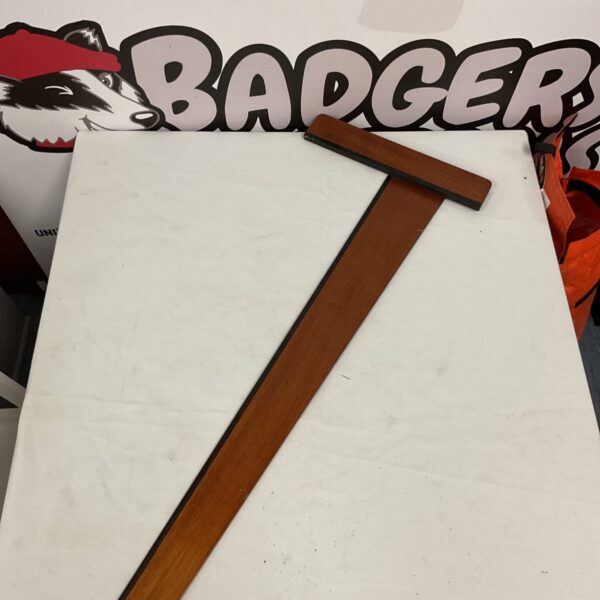 Vintage wooden draftsman set square for technical drawing.