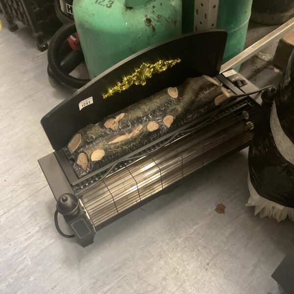 Vintage electric fireplace with faux brick interior and simulated flame.