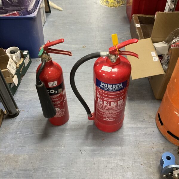 Vintage lot of CO2 and powder fire extinguishers for collectors.
