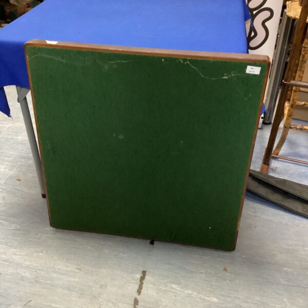 Vintage folding card table for games and dining.