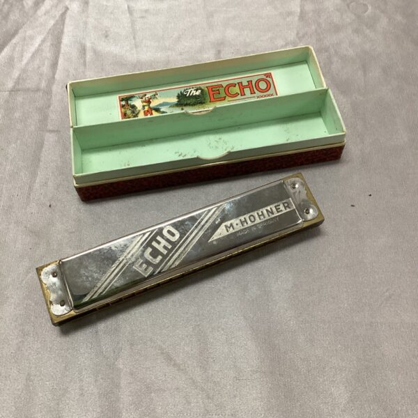 Vintage Hohner Echo harmonica in good condition.