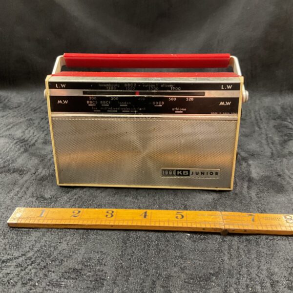 Vintage ITT KB Junior LW MW portable radio in close-up view.