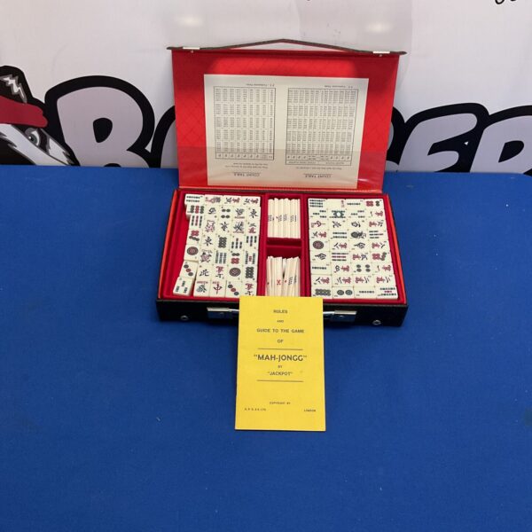 Vintage Jackpot Mahjong game set with rule book, collectible tile game.