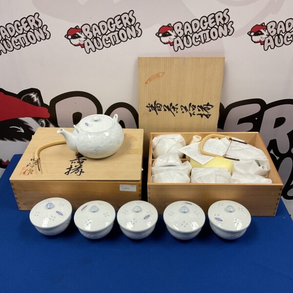 Vintage Japanese porcelain teaset with teapot and cups.