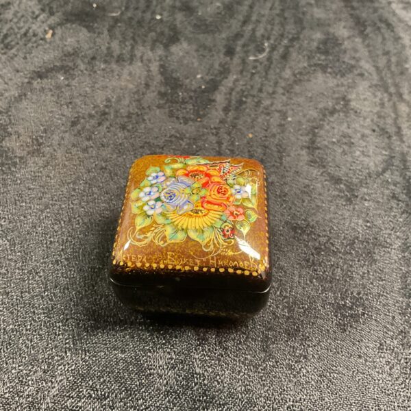 Vintage hand-painted lacquer box with floral design.