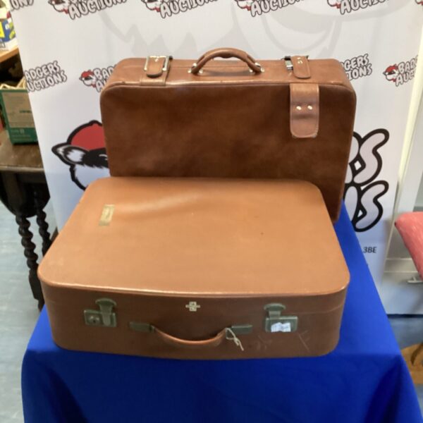 Brown vintage leather suitcase, antique travel luggage.