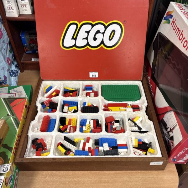 Vintage Lego storage case filled with colourful bricks.