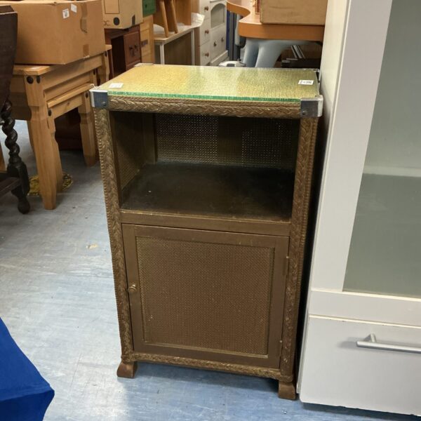 Vintage gold Lloyd Loom bedside cabinet with a single door.