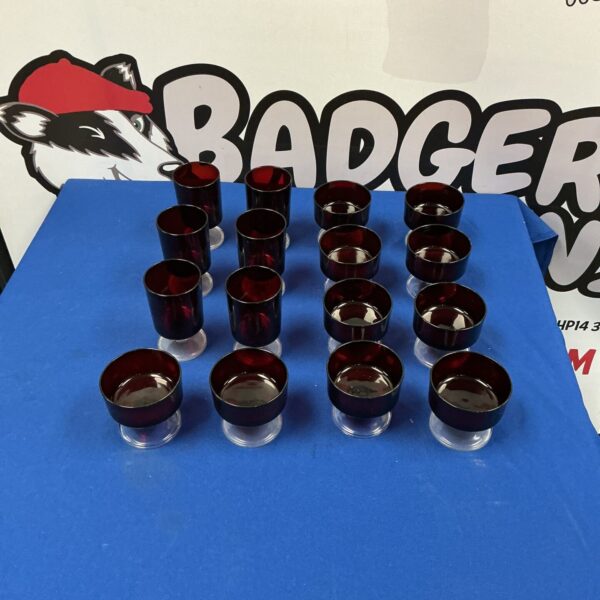 Vintage Luminarc ruby red glasses displayed on a surface.