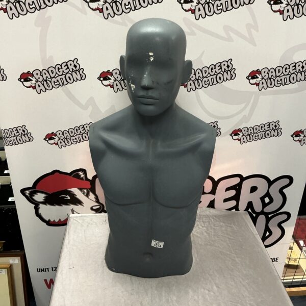 Vintage manikin torso for clothing display.
