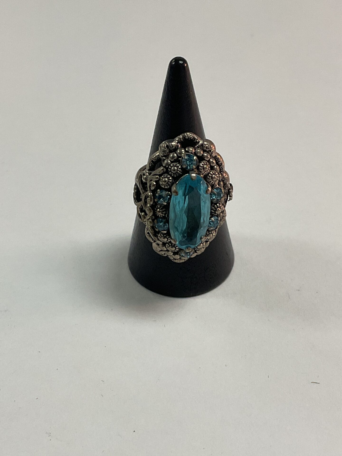 Vintage marcasite ring with a blue stone, size M.
