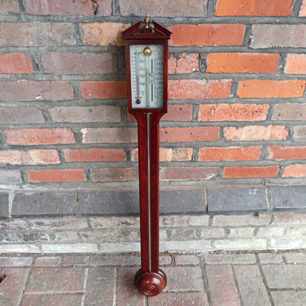Front view of a large vintage mercury wall barometer.