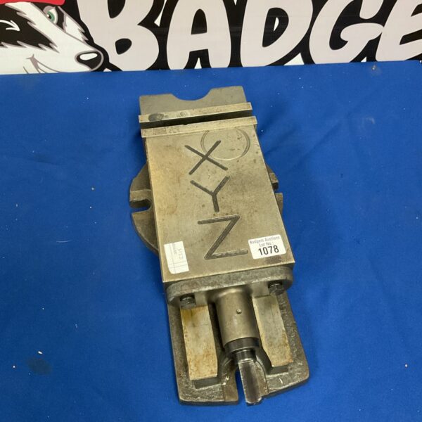 Vintage metal bench clamp for workshop and metalworking projects.