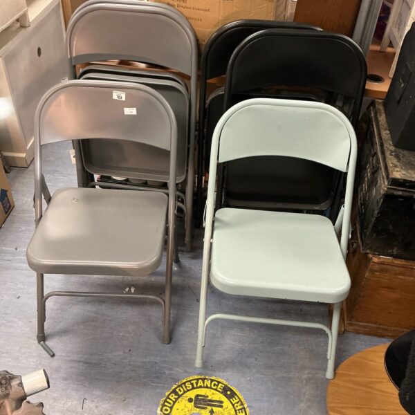 Set of six vintage metal folding chairs in as-found condition.
