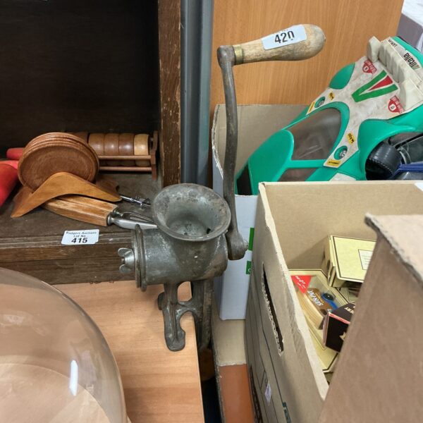 Vintage cast iron mincing machine for kitchen use.