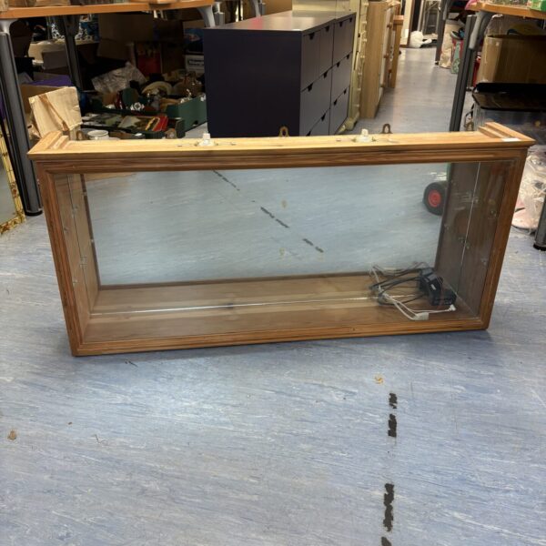 Vintage mirrored pine display cabinet with integrated lighting.