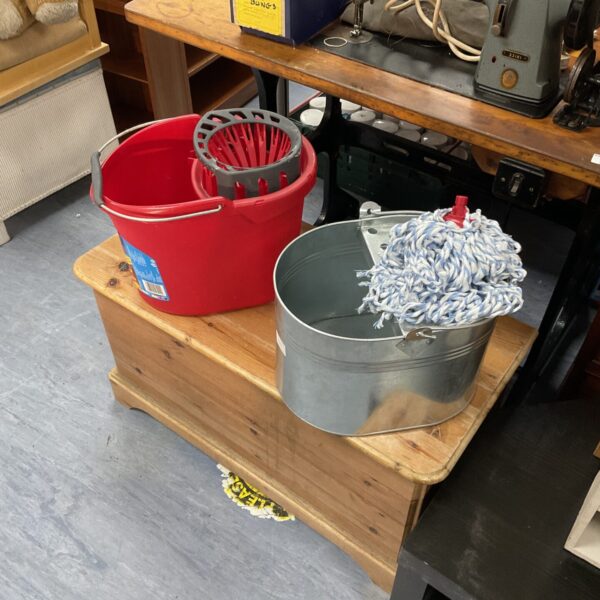 Vintage metal mop buckets with a new Vileda mop head.